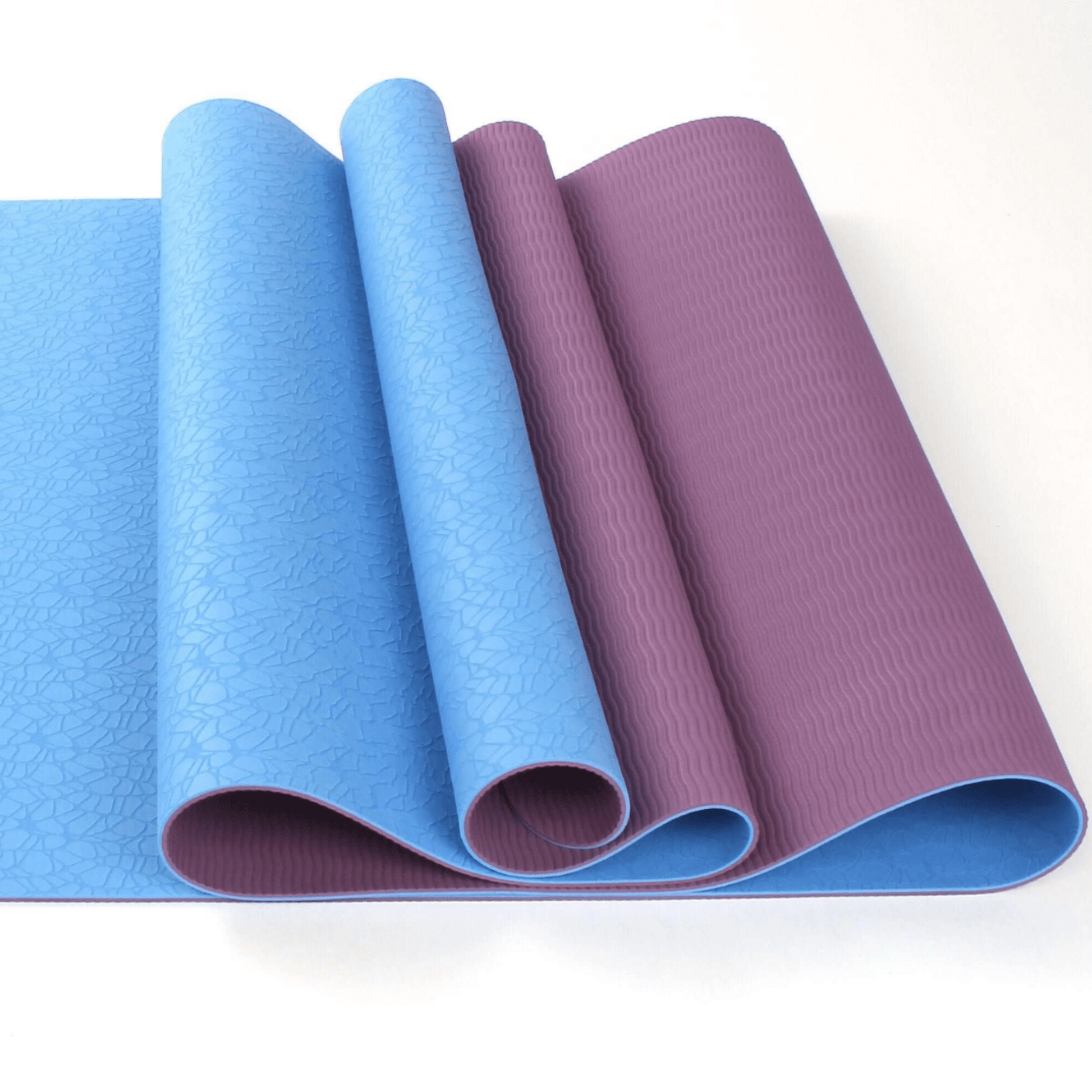 Stacked yoga mats in calming tones – suitable for pilates, stretching, or floor exercises