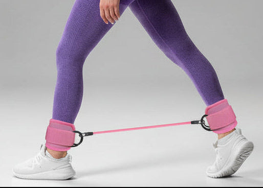 Home workout using ankle resistance bands with cuffs for controlled lower body exercises