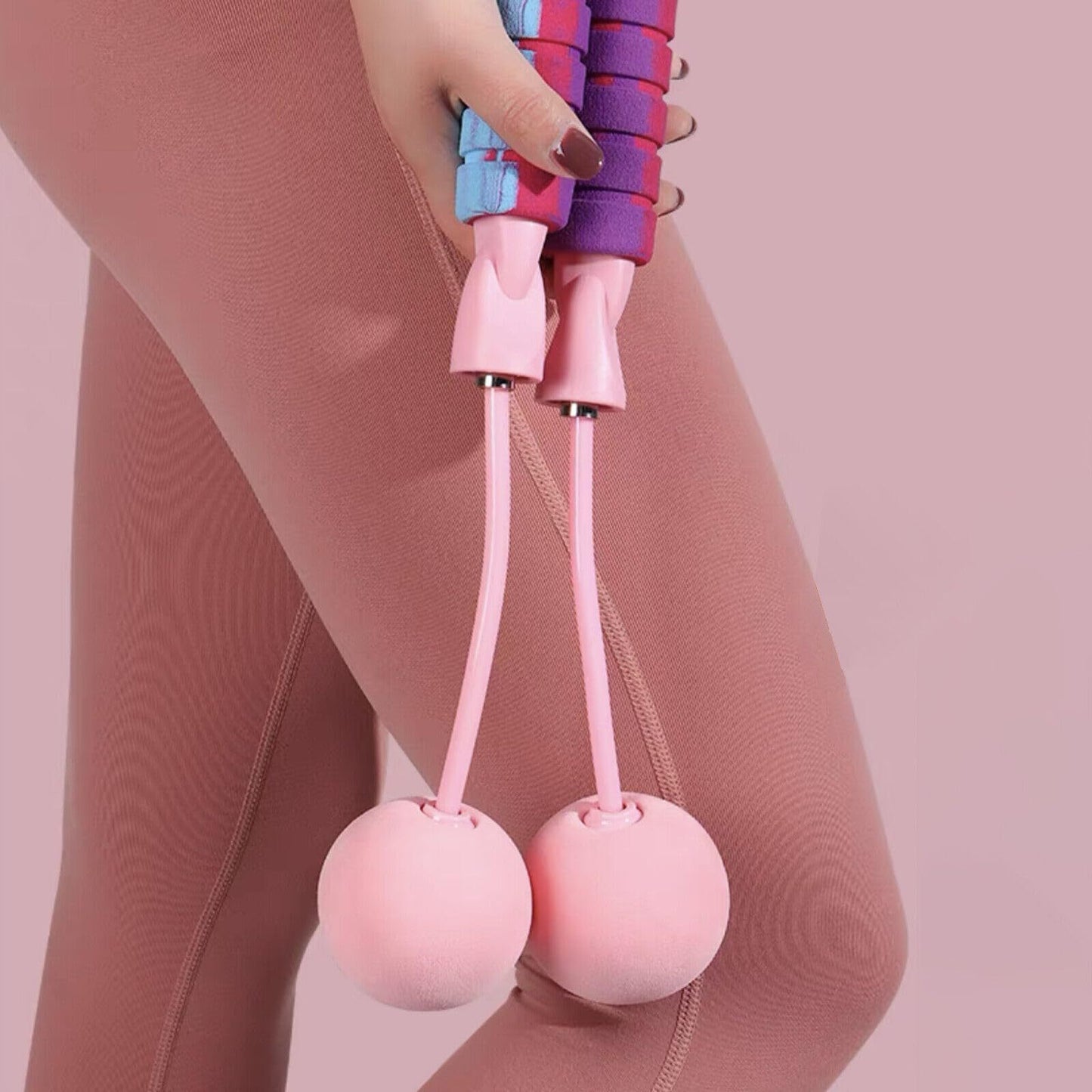 Woman using a weighted cordless jump rope for cardio exercise