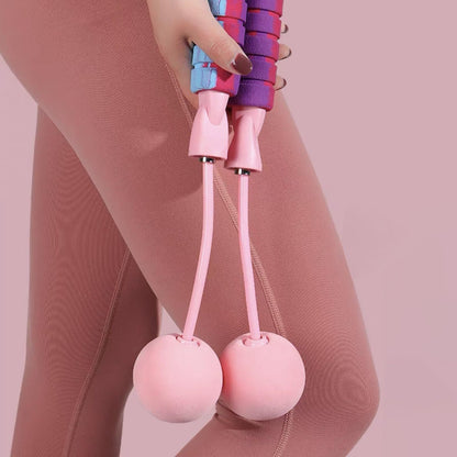 Woman using a weighted cordless jump rope for cardio exercise