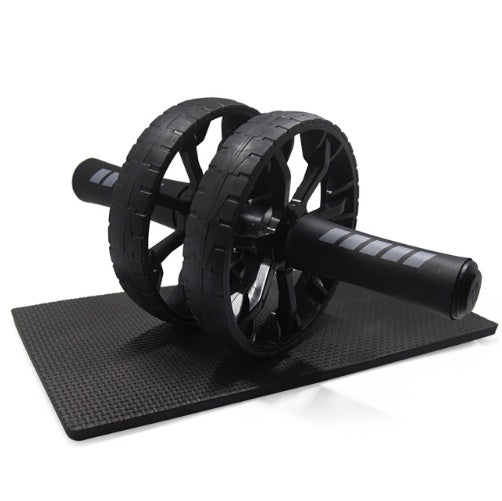 Dual-wheel ab roller placed on included knee mat, ideal for home fitness and abdominal training.

