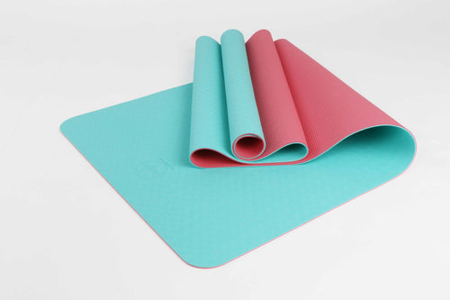Eco-friendly yoga mat in turquoise and pink – non-slip, lightweight design for home practice

