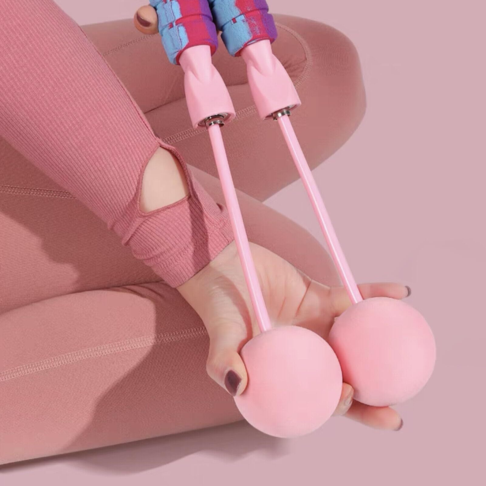 Woman holding a weighted ropeless jump rope during a fitness workout