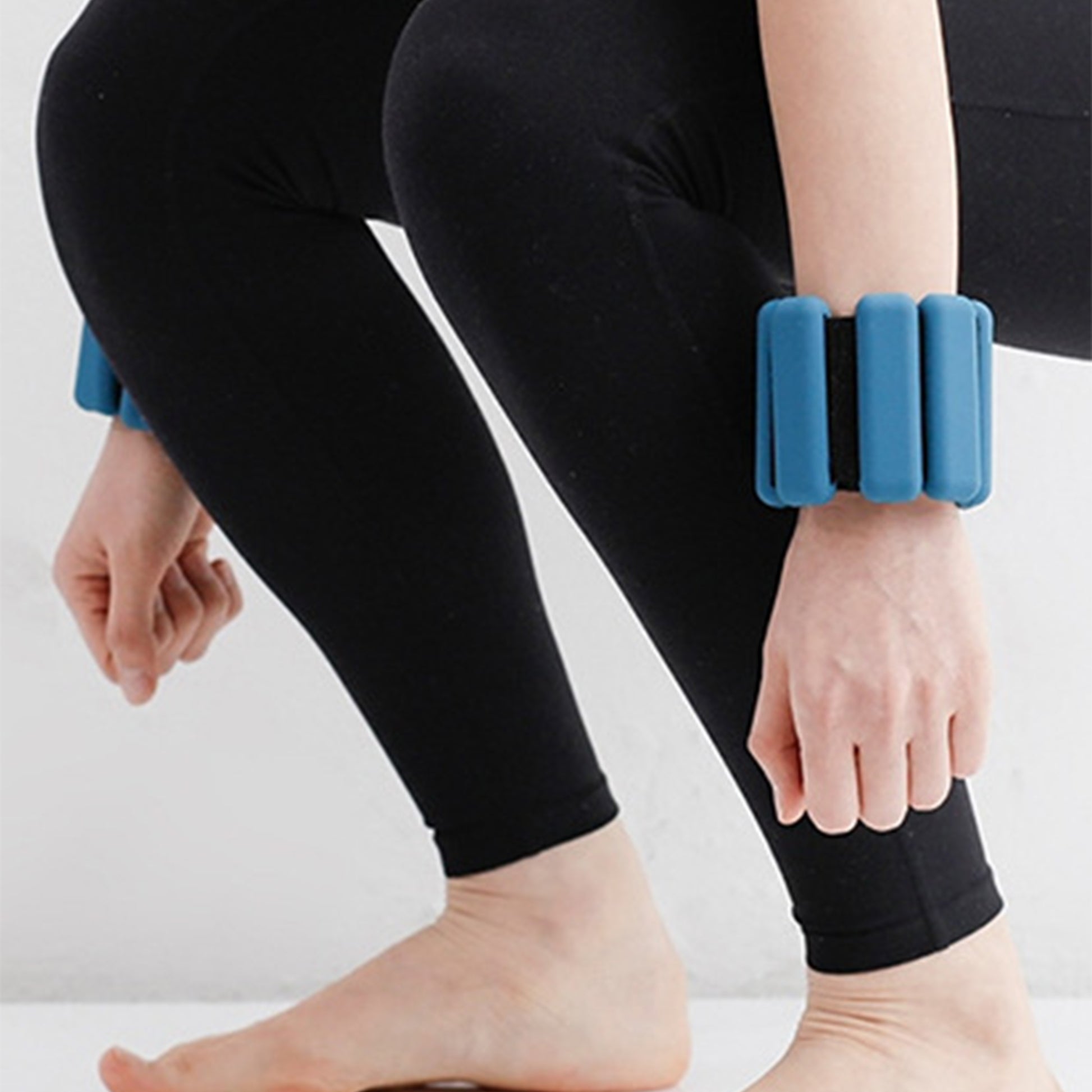 Wrist weights in use during gentle arm workout – home fitness gear for women