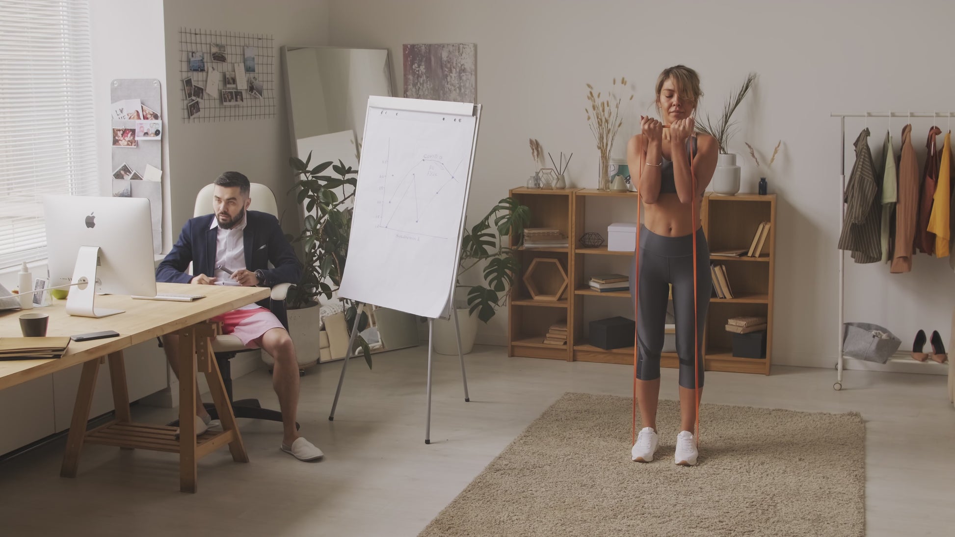 Rear view of resistance band walk outdoors – low-impact glute activation exercise with long elastic band for mindful strength training