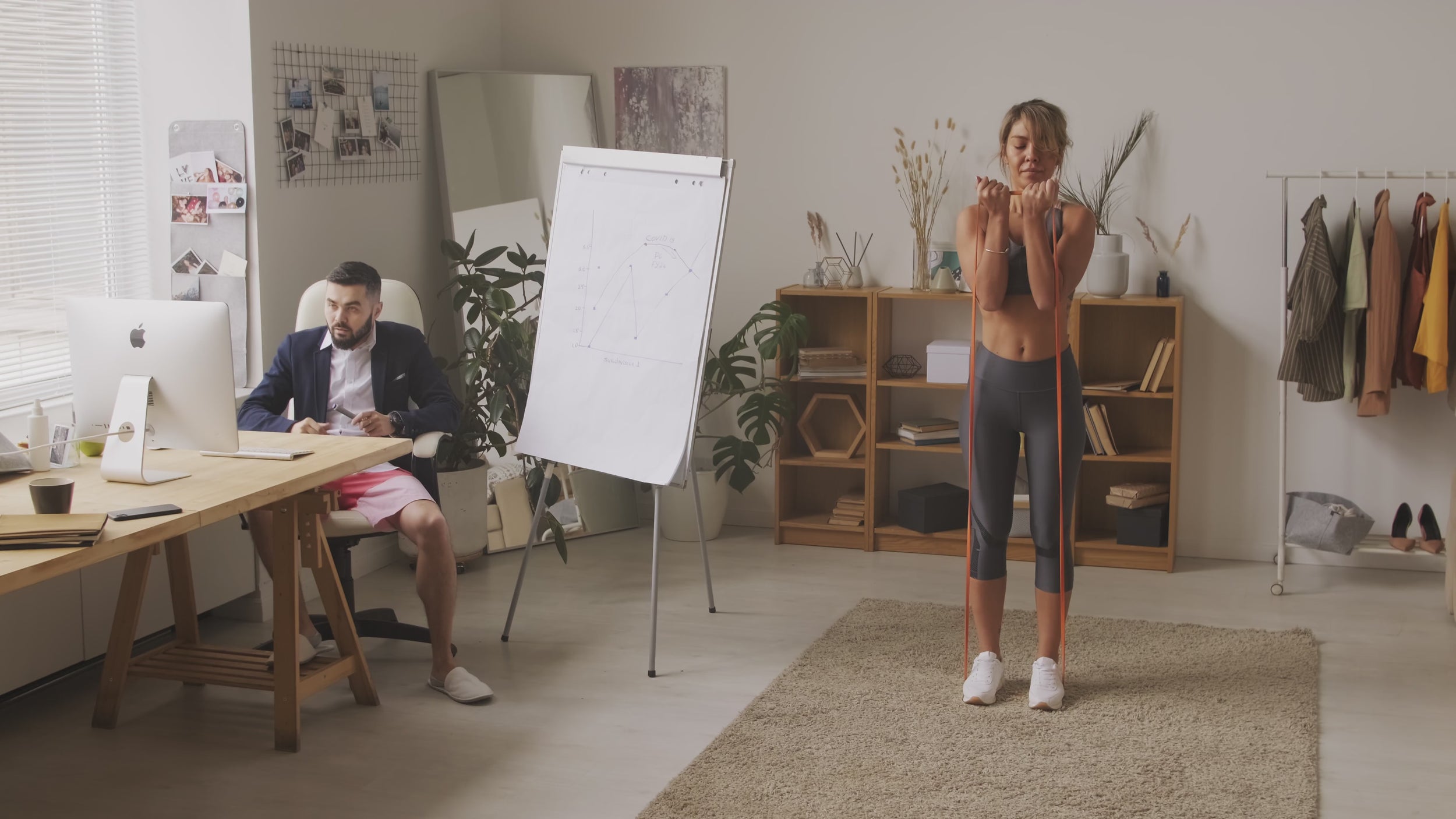 Rear view of resistance band walk outdoors – low-impact glute activation exercise with long elastic band for mindful strength training